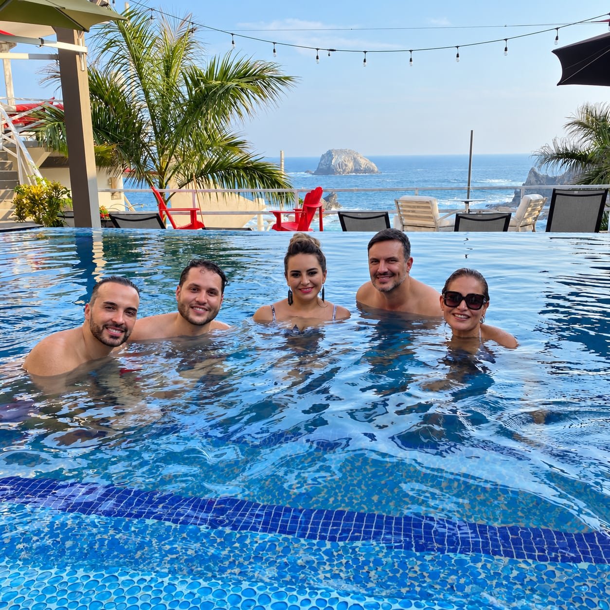 Friends at the ocean-view pool
